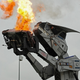 Illustration for article titled Behold The Car-Crushing Fury Of Robosaurus!